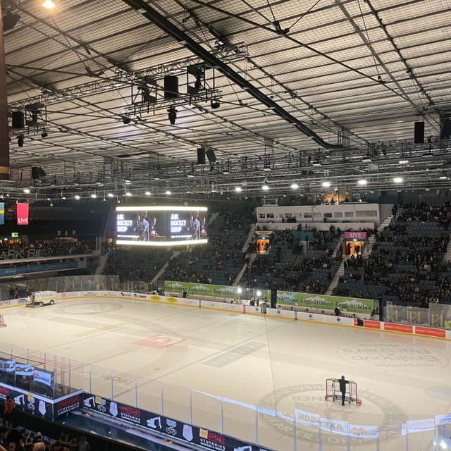 Ice skating rink in Hovet Arena, spacious venue for hockey games and events.