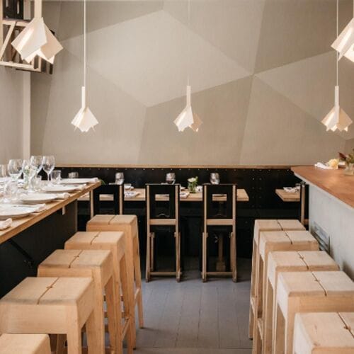 Modern minimalist restaurant in Woodstockholm, perfect for intimate gatherings and events.