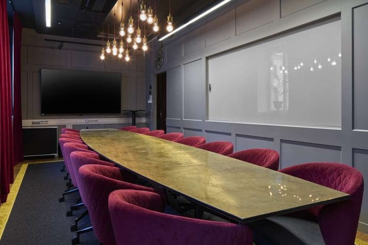 Modern conference room in Scandic Grand Central with plush seating for meetings.