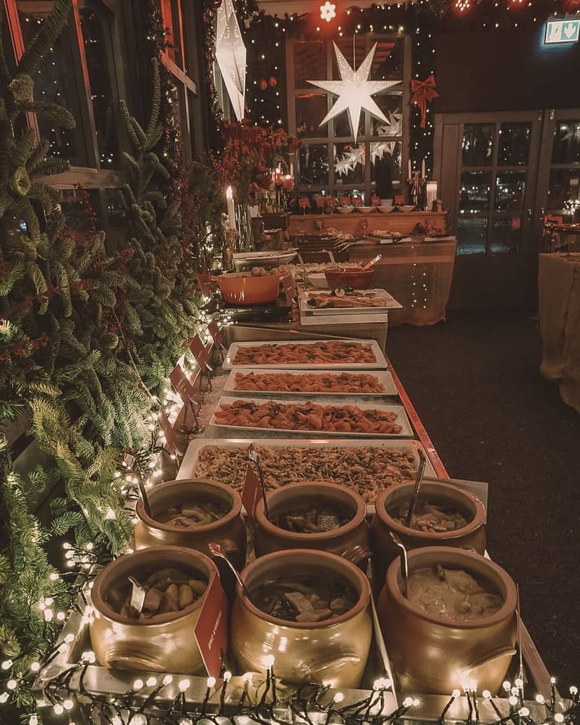 Buffet setup at Josefina Stockholm nightclub for festive events with warm lighting.