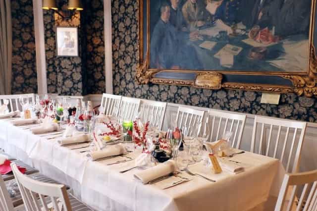 Elegant dining table in Club Room, Villa Godthem for upscale events and gatherings.