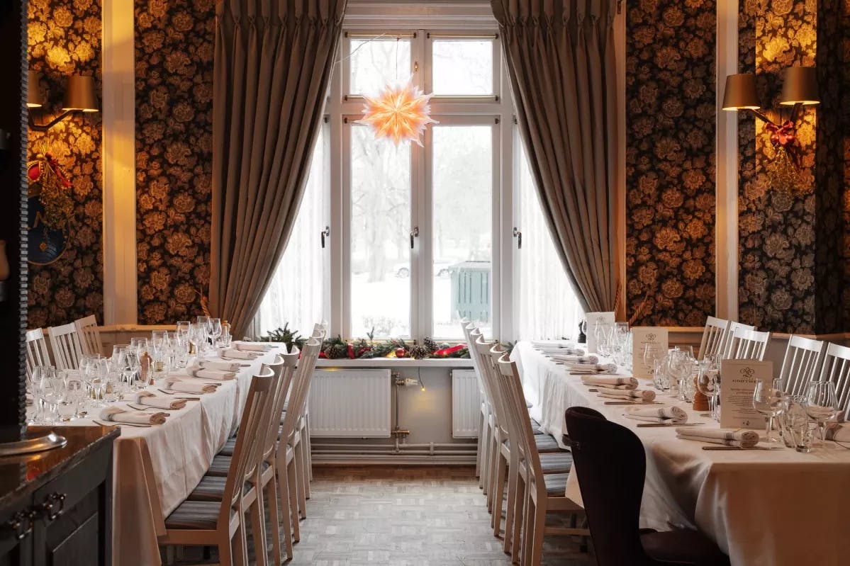 Elegant dining room in Villa Godthem, perfect for formal events and meetings.