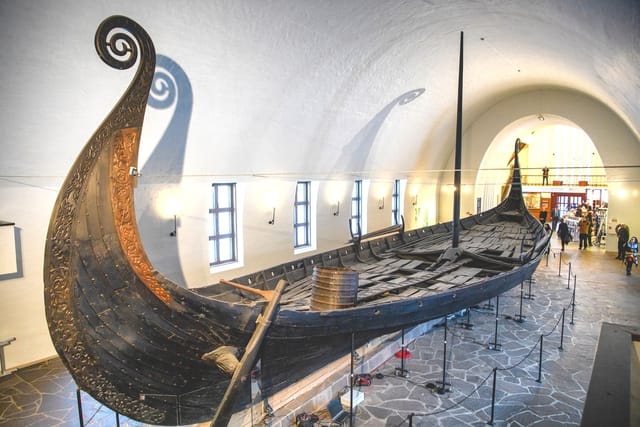 Viking ship display in museum, ideal for themed events and educational gatherings.