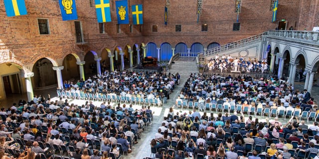 City Hall Stockholm event with audience in organized rows for a formal ceremony.