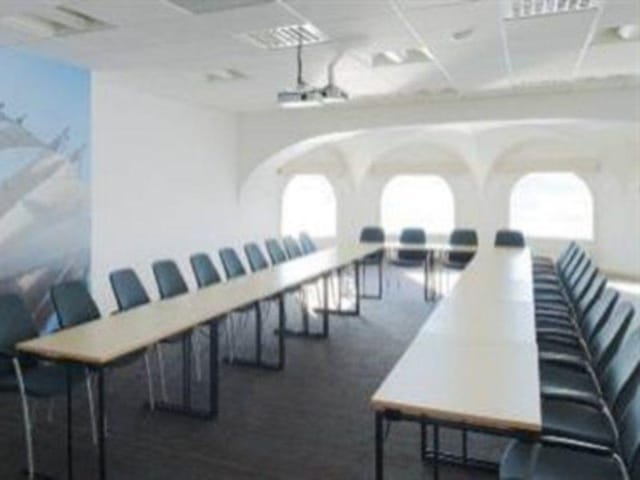 Spacious Scandic Foresta conference room with natural light for meetings and brainstorming.
