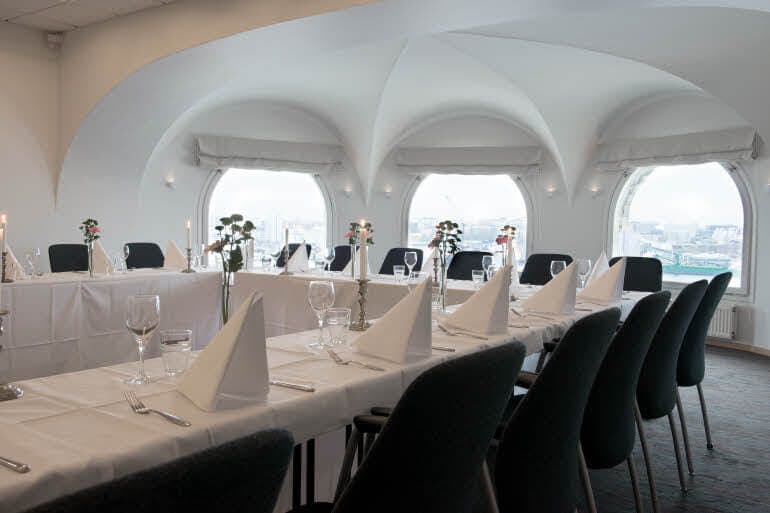 Elegant conference room with panoramic windows for corporate meetings and exclusive events.
