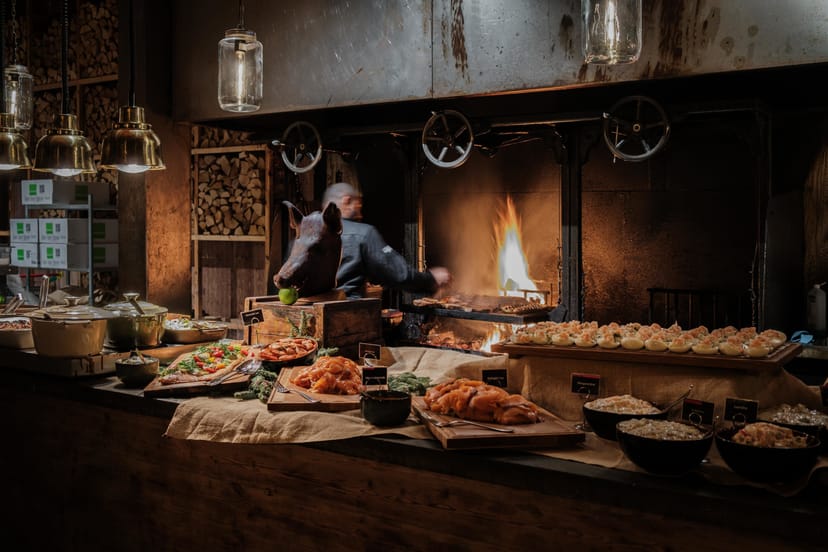 Buffet setup with diverse dishes at Steninge Bruk restaurant for upscale events.