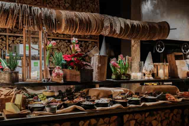 Buffet display at Steninge Bruk restaurant with rustic decor for events and gatherings.
