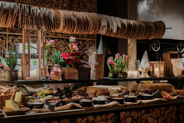 Buffet display at Steninge Bruk restaurant with rustic decor for events and gatherings.