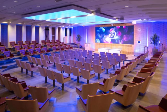 Modern conference room with tiered seating for impactful presentations and events.