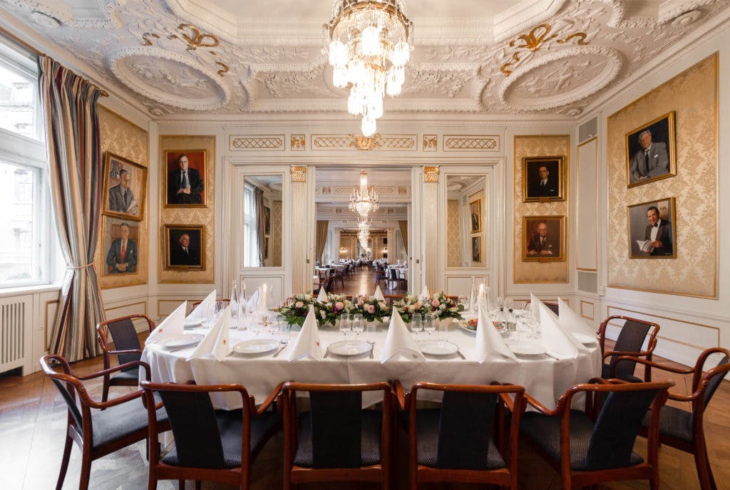 Elegant ballroom with round tables, ideal for corporate events and formal dinners.