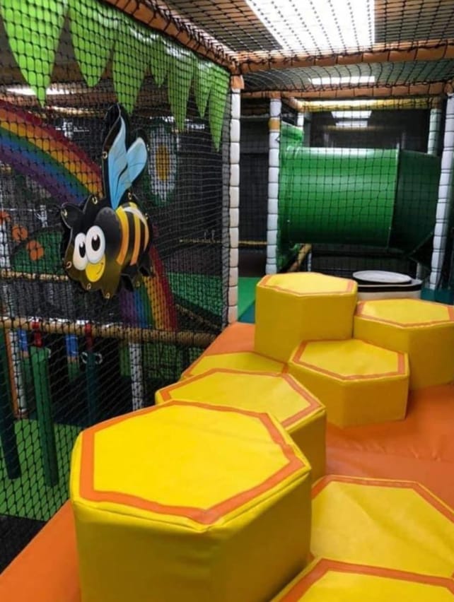Neon Party Room with colorful soft play structures for kids' birthday parties and events.