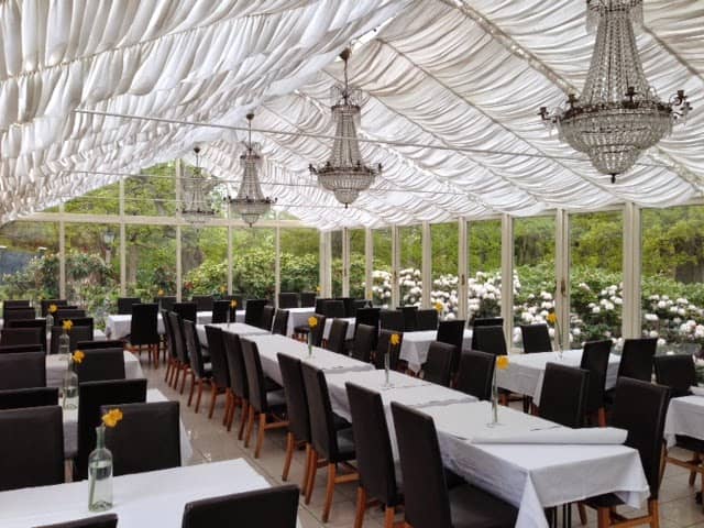 Elegant event space at Rosendals Wärdshus with chandeliers, perfect for weddings and gatherings.