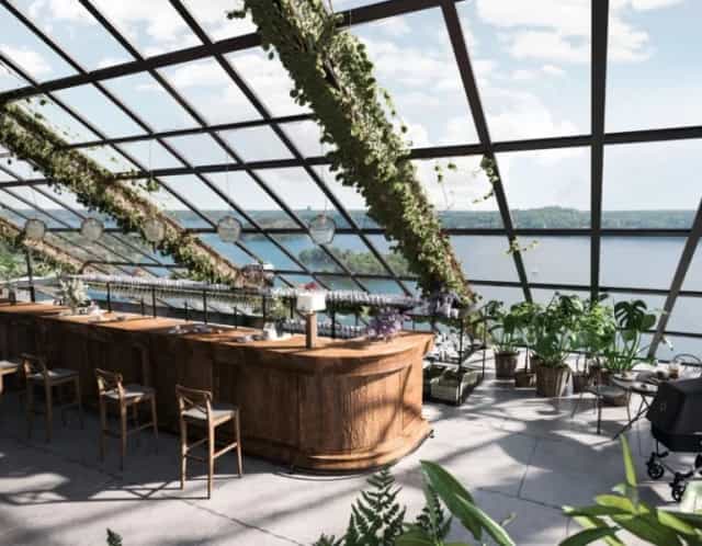 Bistro at Rosendals Wärdshus: elegant glass venue for events with panoramic water views.