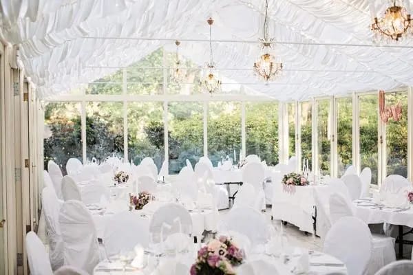 Elegant banquet hall with floral centerpieces, perfect for weddings and formal events.
