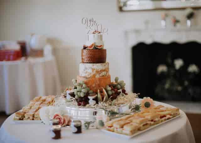 Elegant multi-tiered cake display at The Tabor Room, Parklands Quendon Hall, for events.