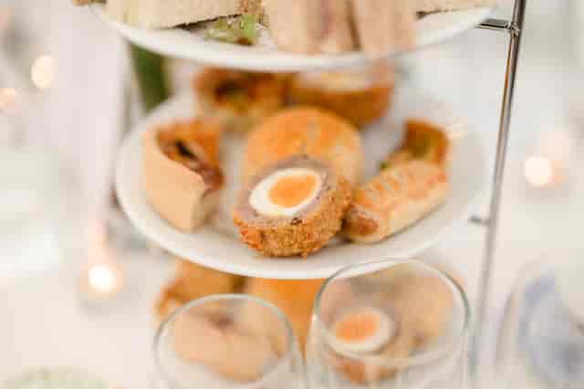 Elegant tiered platter of gourmet hors d'oeuvres for events at Tabor Room, Quendon Hall.