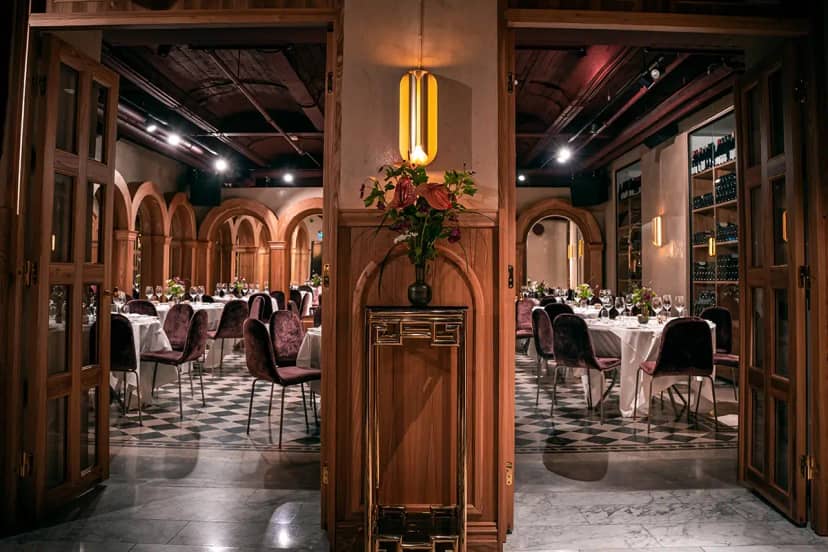 Elegant BooBook event space with floral centerpieces, perfect for upscale gatherings.