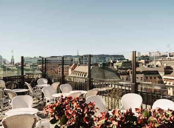 Rooftop venue at Le Hibou, stylish seating, ideal for upscale events and gatherings.