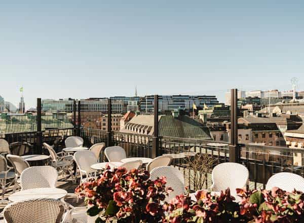 Rooftop venue at Le Hibou, stylish seating, ideal for upscale events and gatherings.