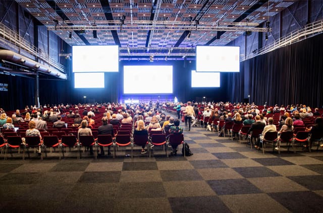 Stockholmsmässan conference hall with attendees at a professional event.