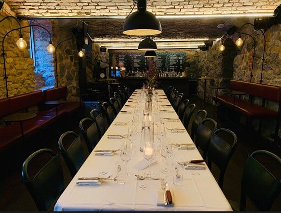 Elegant dining table in cozy restaurant, perfect for private dinners and upscale events.