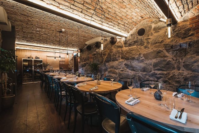 Intimate restaurant dining space with rustic decor, ideal for corporate events and celebrations.