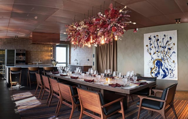 Elegant beer garden with floral centerpiece, ideal for networking dinners and private events.
