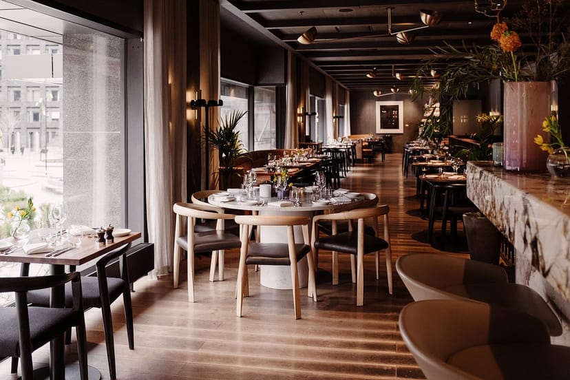 Elegant dining room with natural light, perfect for upscale events and corporate meetings.