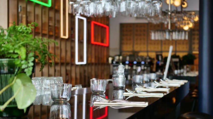 Heurlins restaurant at Clarion Hotel Sign, modern dining setup with elegant bar, networking events.