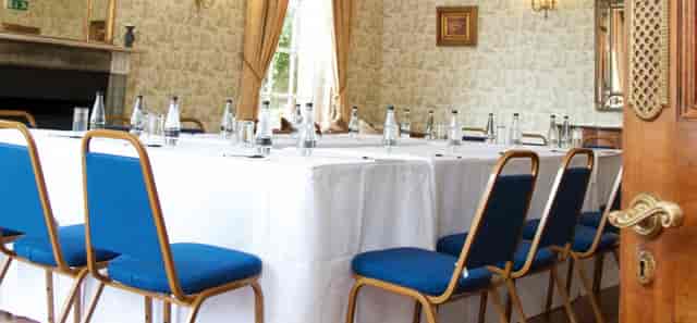 Drawing Room at Parklands Quendon Hall, elegant meeting space with blue chairs.