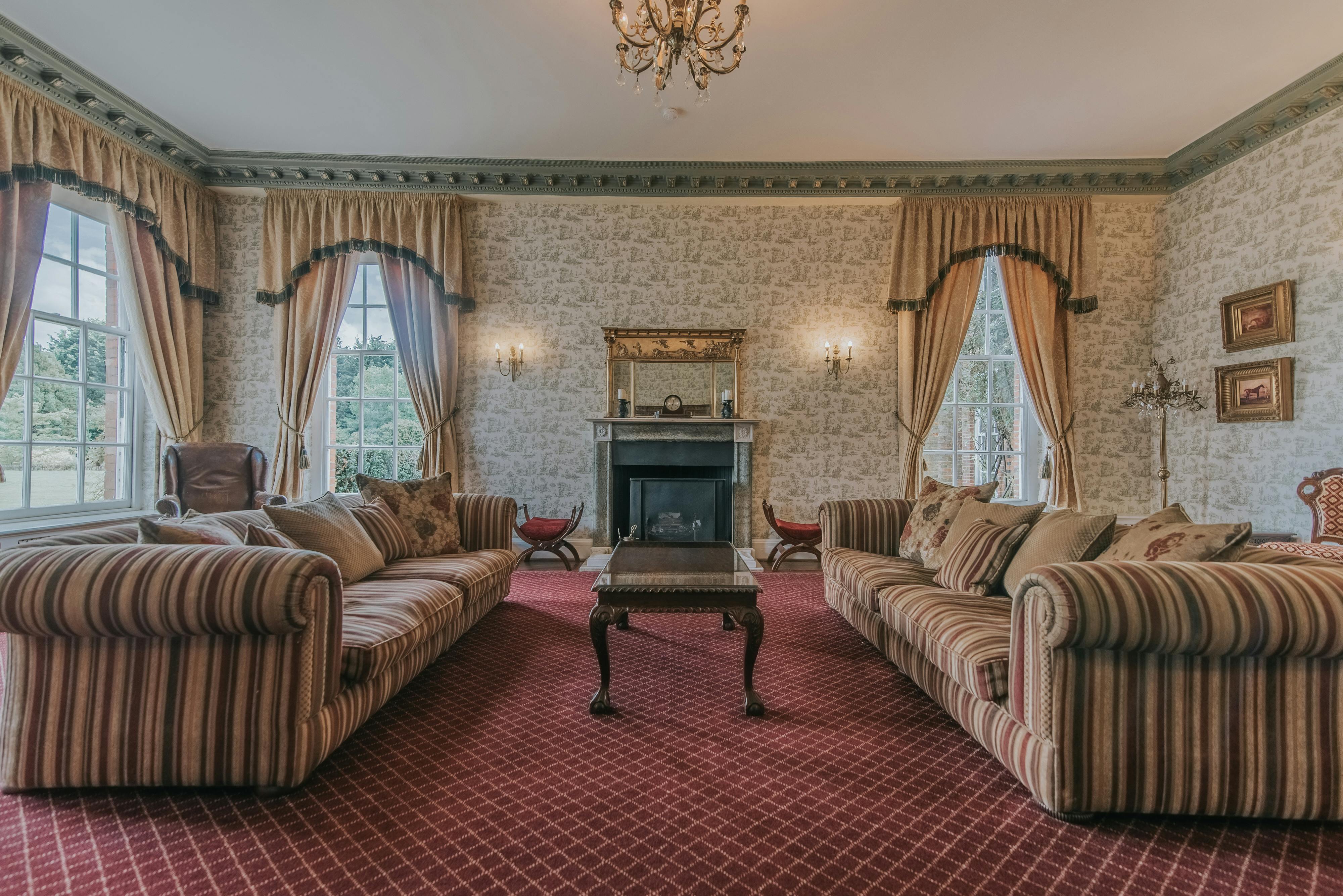 Elegant Drawing Room at Parklands Quendon Hall, ideal for meetings and gatherings.