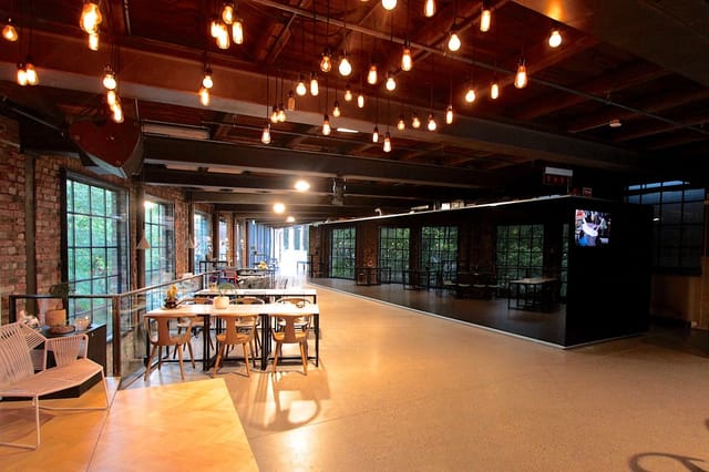 Foyer in Dansens Hus: industrial-chic event space with exposed brick, ideal for gatherings.