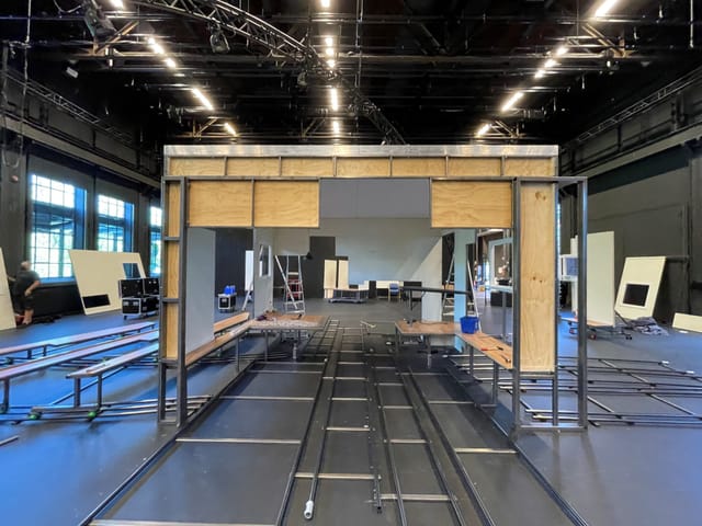 Partially constructed event space with stage framework at Dansens Hus for dynamic exhibitions.