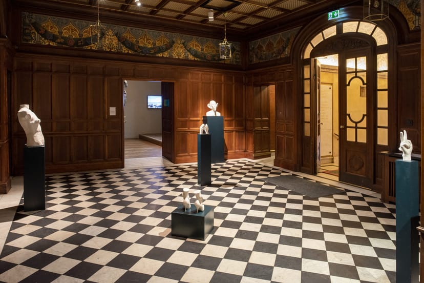 Sophisticated event space with checkered floor, ideal for upscale receptions and exhibitions.