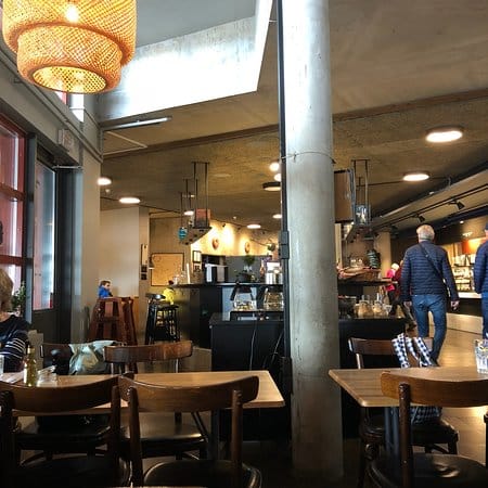 Modern café at Vasa Restaurant, warm lighting, ideal for networking events and meetings.