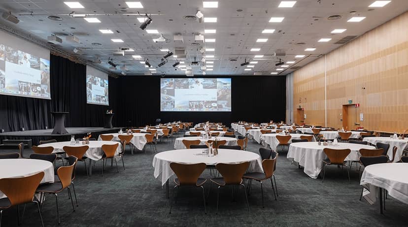 Conference room at Clarion Hotel Amaranten, set for a corporate event with round tables.