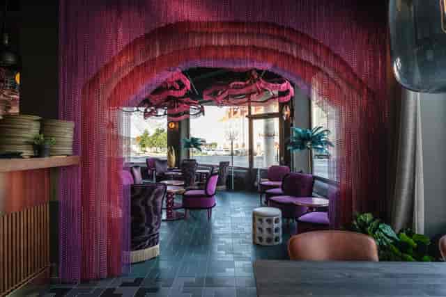 Heurlins restaurant event space with colorful drapery, ideal for meetings and social functions.