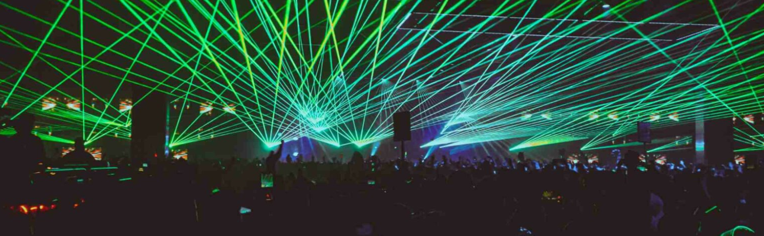 Vibrant laser displays at Whole Venue, N7 London for dynamic concerts and events. - Banner
