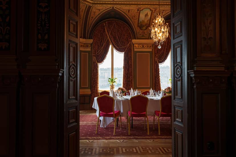 Elegant dining room with chandeliers, perfect for corporate dinners and private events.
