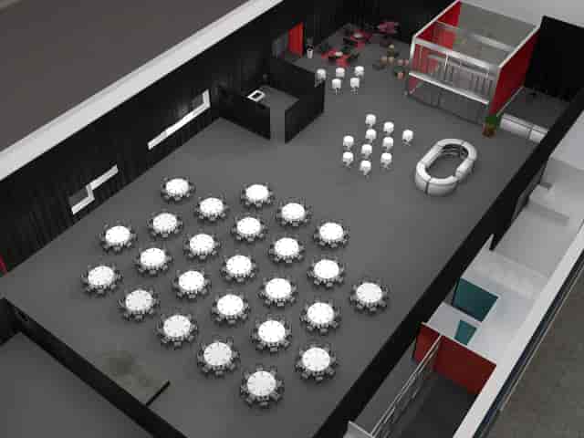 Auditorium in Magasin 9 with round tables, perfect for gala or corporate dinner events.