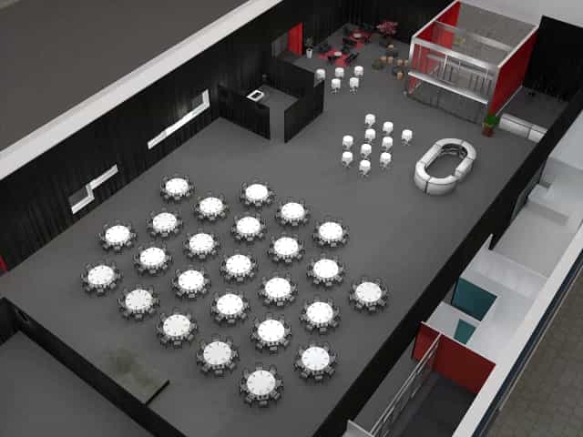 Auditorium in Magasin 9 with round tables, perfect for gala or corporate dinner events.