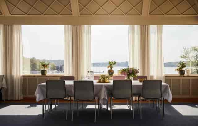 "Bright meeting space with floral decor at Grand Hotel Saltsjöbaden for small gatherings."