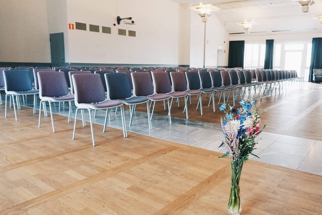 Corporate event venue at Grand Hotel Saltsjöbaden with elegant floral arrangement.