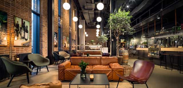 Modern restaurant venue with warm lighting for corporate events and social gatherings.