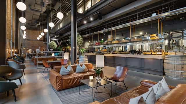 Modern wine bar at The Winery Hotel, ideal for meetings and events with stylish seating.