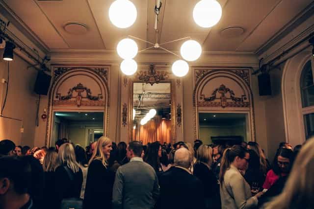 Vibrant networking event at Kristallen, Södra Teatern with stylish decor and lively crowd.