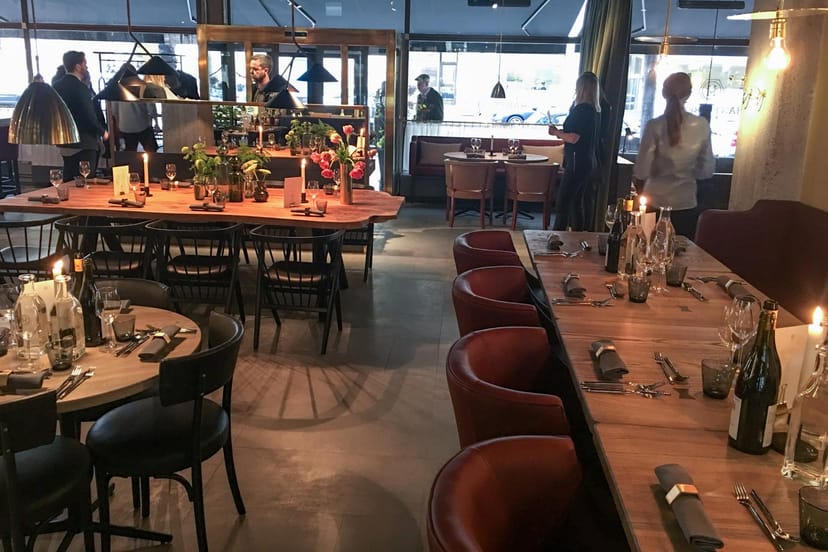 Stylish event space at Restaurang Hantverket with elegant tables for networking dinners.