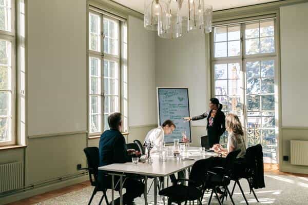 Conference center meeting room with large windows, ideal for productive events and collaboration.