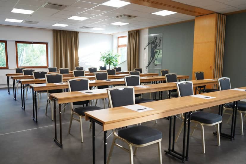 Conference center meeting room with natural light, ideal for workshops and training sessions.